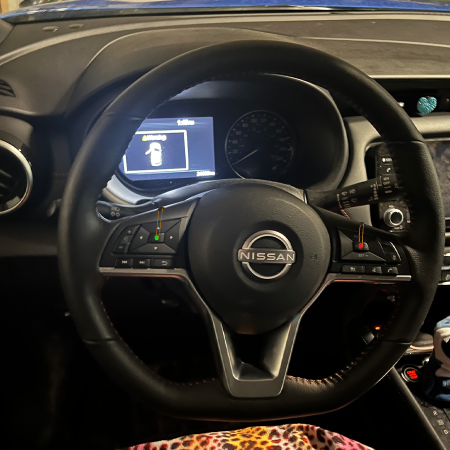 Adding a light on the buttons in a car which makes them more noticable and hopefully not distracting