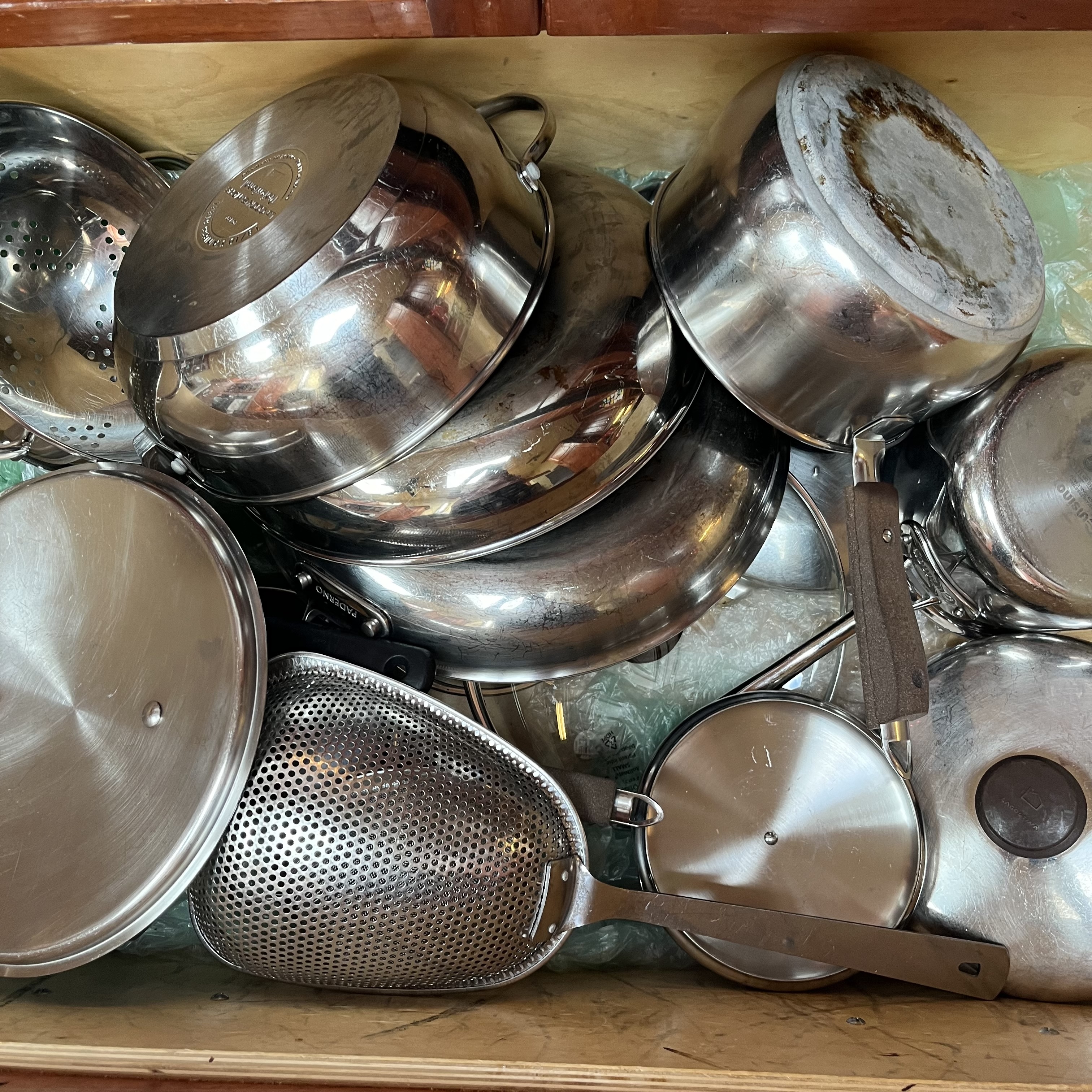 The sound of pots clashing together in a drawer